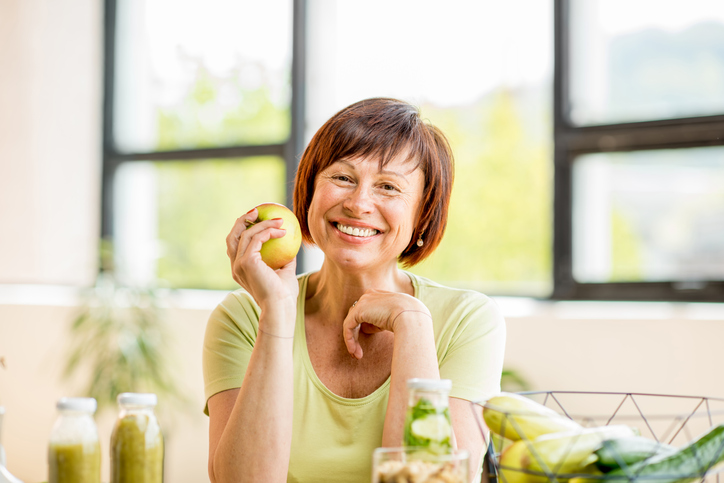 Older woman with healthy food indoors